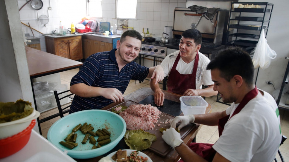 "People here don't have much of an idea about Arab food, so it's a chance to show my culture," says Tony (left) who works in his uncle's restaurant as manager and cook.