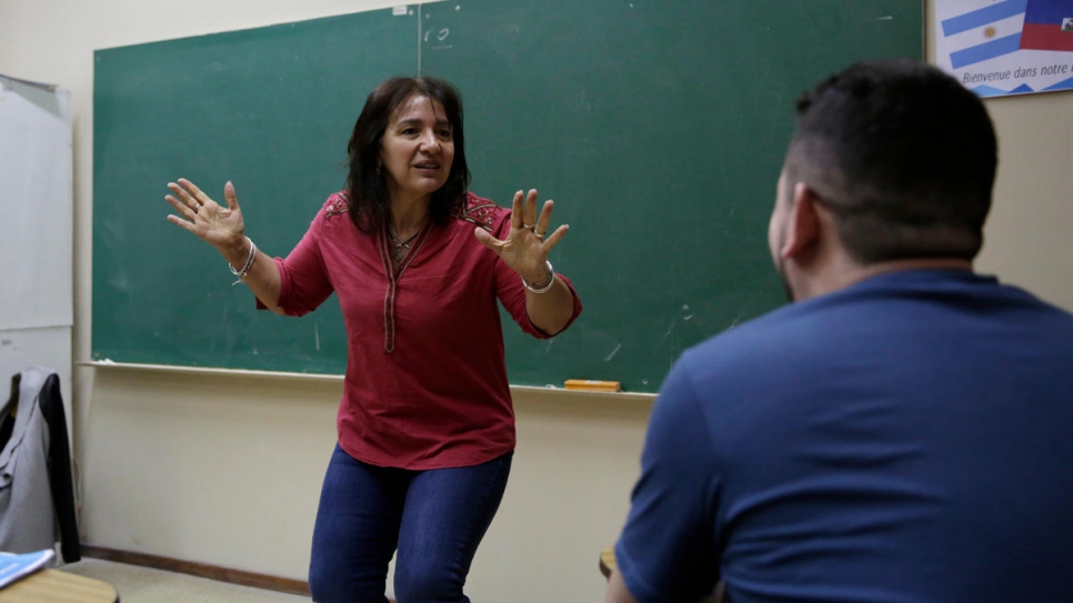 Tony Kassab, from Syria, takes Spanish classes at the National University of Córdoba with teacher Verónica Segui.