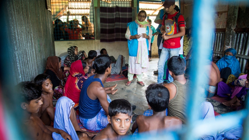 Mahmuda talks to Rohingya boat wreck survivors who lost relatives when their boat capsized on Inani Beach near Cox's Bazar, Bangladesh.