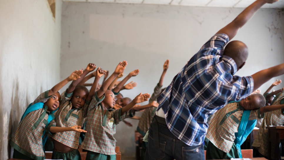 Suleiman Aliyu, 40, Headmaster of the first Future Prowess Islamic Foundation School in Maiduguri leads pupils in early morning stretch exercises.