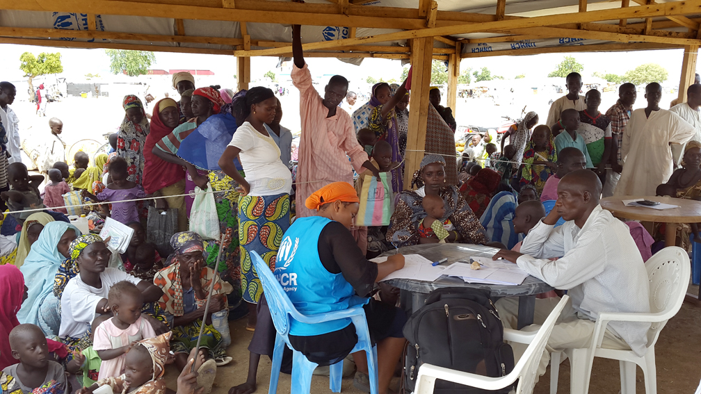UNHCR staff registers the new Nigerian arrivals in Minawao camp. UNHCR / DJERASSEM MBAIOREM