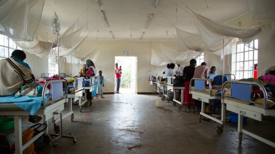 Parents visit their sick children at the health centre at Nakivale settlement.