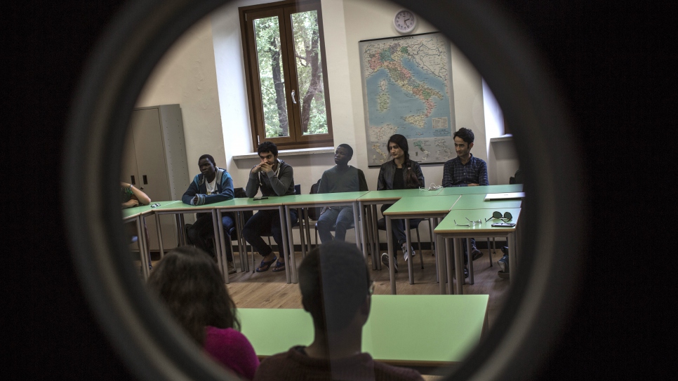 Emmanuel, in the first semester of his first year at UWC Adriatic, and his classmates attend a lecture held by UNHCR reporter Helen Womack.