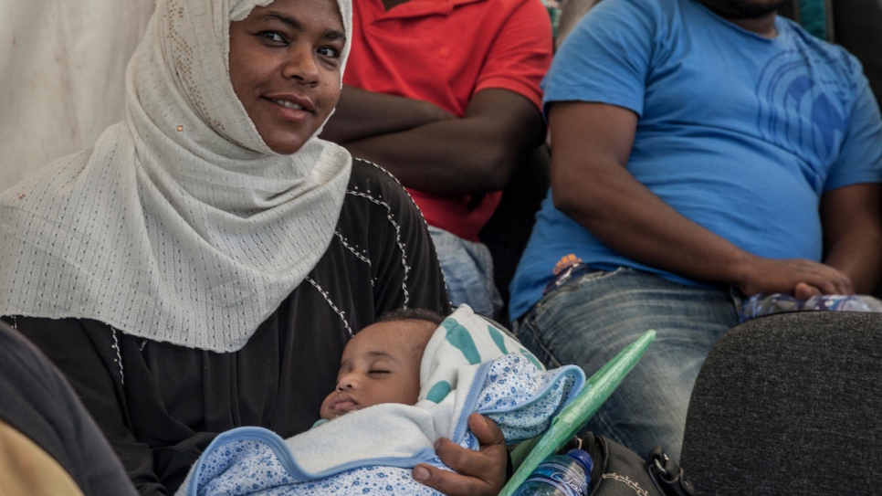 Yemeni refugee mother waits to receive her child's birth certificate. The Government of Ethiopia is issuing legal civil documents to refugees in the country.
