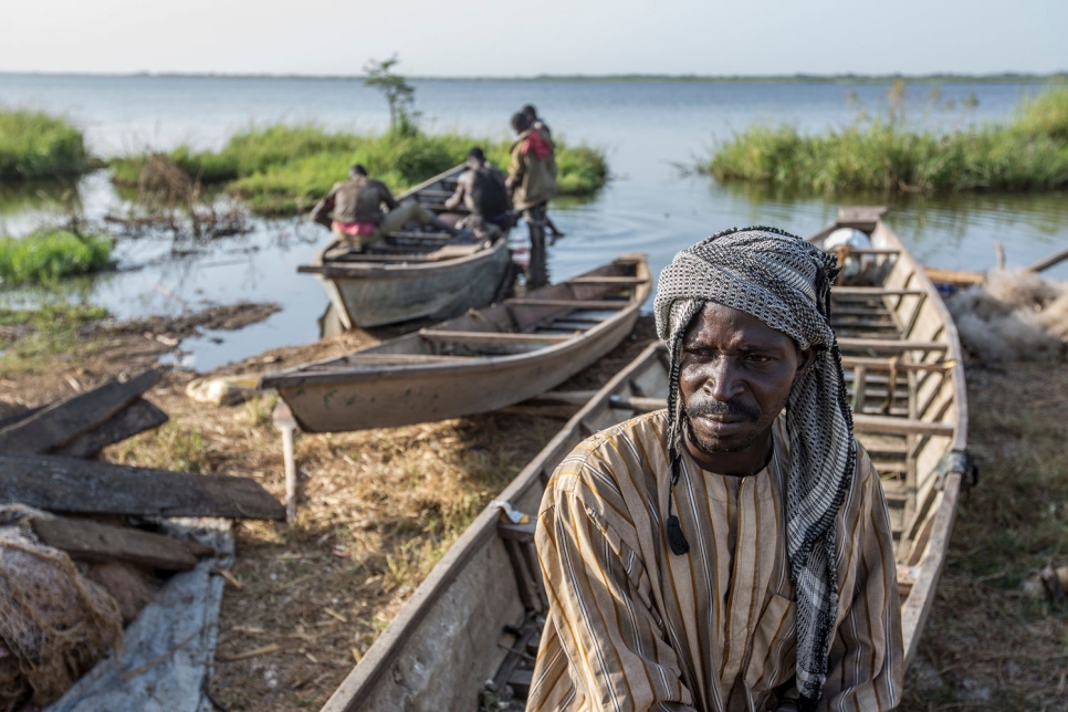 Hawali Oumar, 43, a refugee from Nigeria, fishing on the shores of Lake Chad. Hawali's father was killed by Boko Haram in his village, prompting Hawali to flee with his family to Chad.