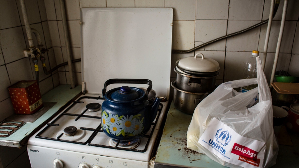 The kitchen stove inside the apartment that Hanna shares with her sick husband Oleksiy in Shchastya.