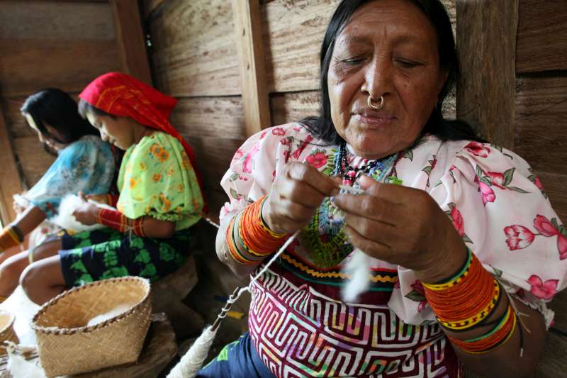 These indigenous Tule women in Colombia's Choco region prepare cotton to be used in making traditional clothes and material. They have only recently been able to return to their land, but damage to the environment and the presence of armed groups makes their future uncertain. The land and their connection to it is very important in Tule culture. 