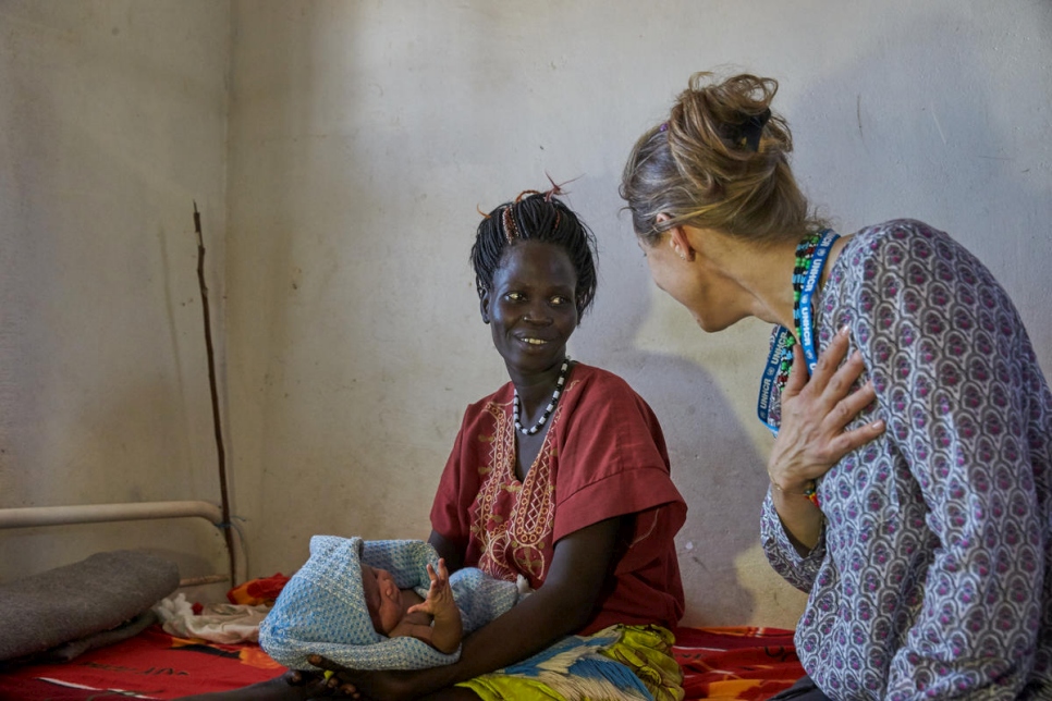 Princess Sarah Zeid of Jordan talks to a mother and her new born baby at the Bunj Hospital in Maban refugee camp.