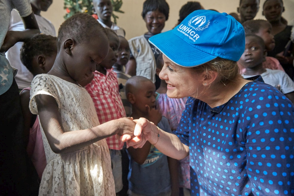 Princess Sarah Zeid meets a young girl at an orphanage in Juba, South Sudan.