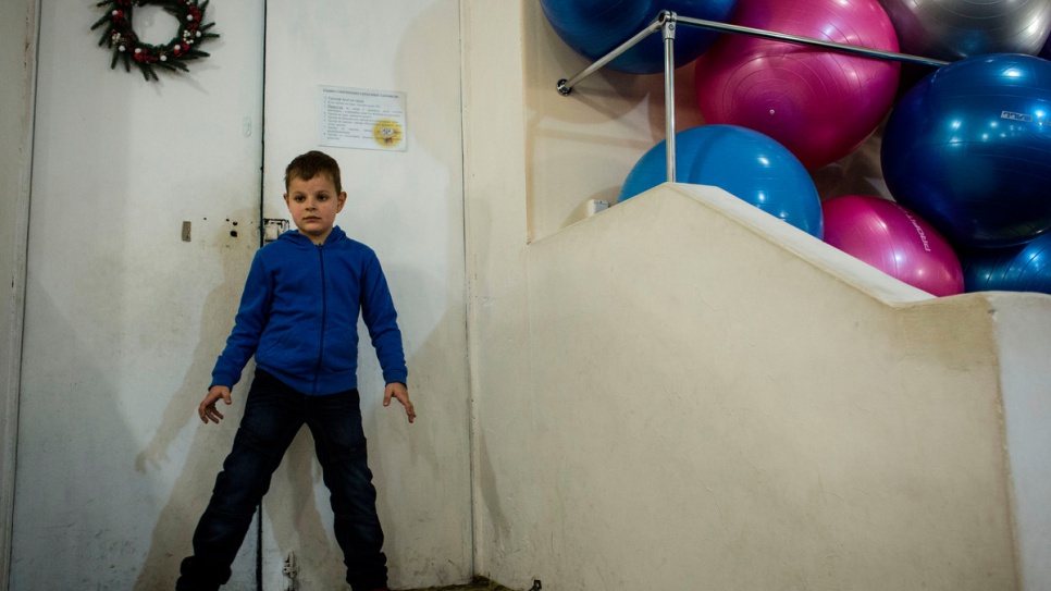 Igor waits for his brother Ivan, who is attending a dance class after school.