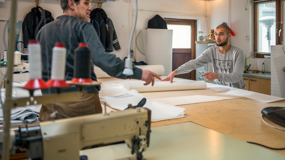 "It's really amazing – so many German people have helped us," says curtain maker Mohammed (left), 51, who now works with his son Yousef at the Kiel sailmaking company Coastworxx.