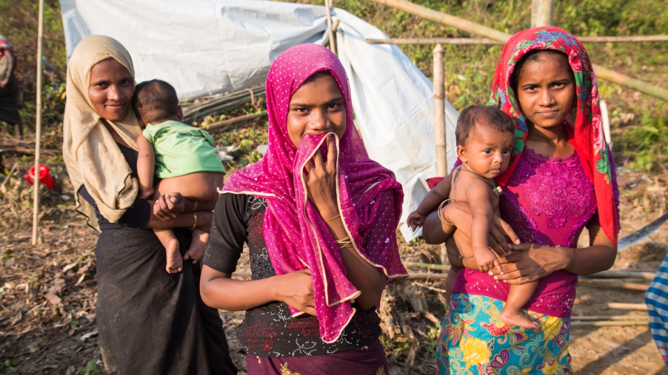 Dil Bahar, 25, Yasmin, 15, and Humaira, 21, fled their homes after their village was burnt. They were relocated by UNHCR to Kutupalong Extension.