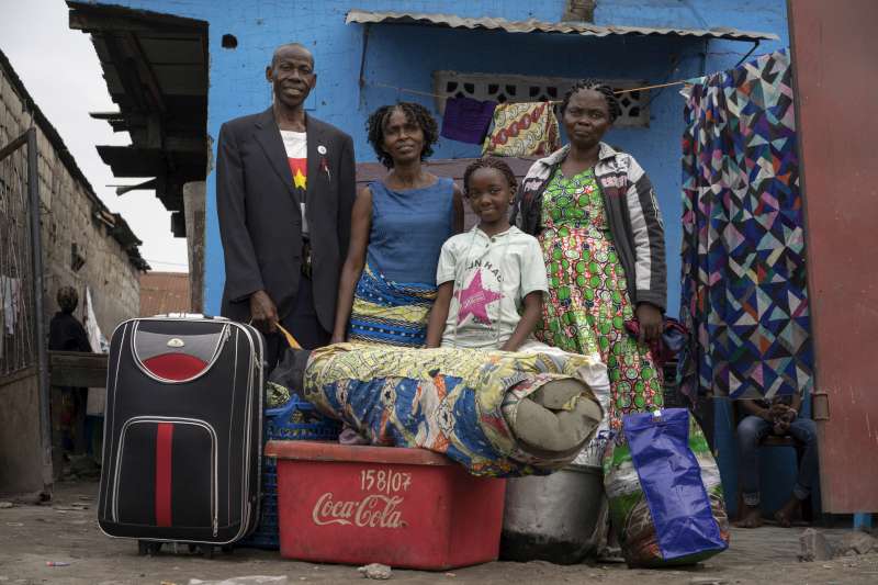 Antonio and his family with all their belongings, including packed suitcases, plastic containers and a mattress. They gave away things they did not need to friends and relatives. They were among the first group of former Angolan refugees to be repatriated.
