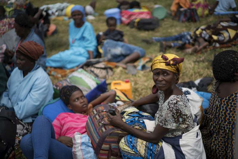 Maria waits with other former Angolan refugees to board a train in Kinshasa, capital of the Democratic Republic of the Congo. The first leg of their jouney will take them on a seven-hour train journey to Kimpese in Bas-Congo province. "I am so moved to go back that I can't stop my tears,» Maria says.
 
