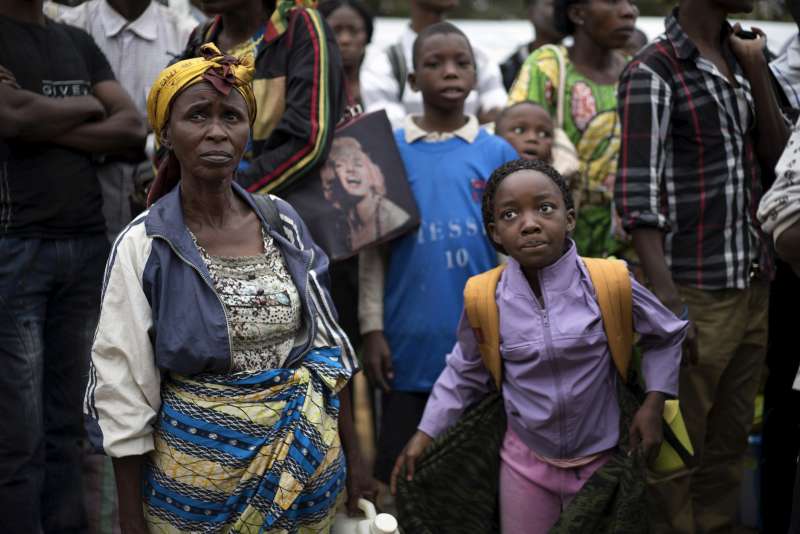 Maria (left) and Faria prepare to board buses which will carry them on the 100-km road journey from Kimpese to the border with Angola. UNHCR plans to repatriate some 30,000 former refugees under a voluntary programme.