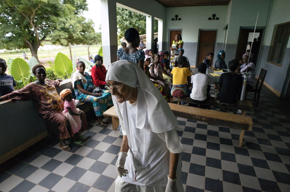 Always busy, 80-year-old Sister Maria Concetta walks through the reception area of the hospital her order operates in Zongo, Equateur Province, DRC.