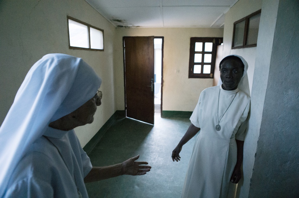 Sister Maria, 80, speaks with a fellow nun at the hospital their order operates in Zongo, Equateur Province, DRC.