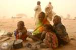 Young, new arrivals from Sudan’s Darfur region endure a sandstorm in the border town of Bamina, eastern Chad. Rainfall in this region has been in decline since 1950. This, coupled with deforestation, has had a devastating effect on the environment. 