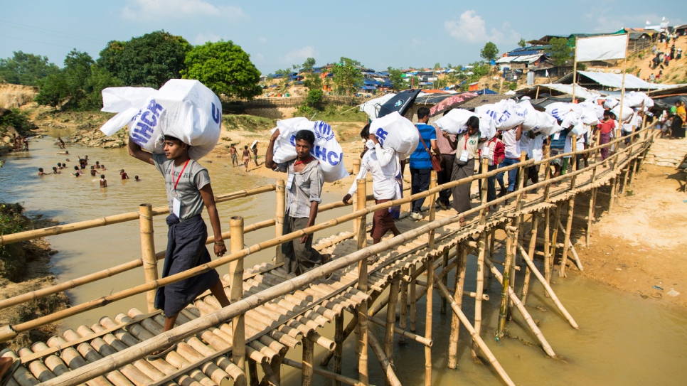 The UN Refugee Agency relocated some 1,700 new refugees to a government-allocated site in south-eastern Bangladesh, giving them a home after weeks on the move. © UNHCR/Roger Arnold