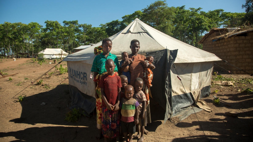 Burundi refugees Mariana (left) and Venansiya (right) with their children outside their emergency shelter in Nduta refugee camp.