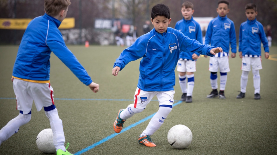 "I couldn't play football in Syria, but here I can play whenever I want." Eight-year-old Syrian refugee Ahmad Alzaher takes part in a trial for Bundesliga club Hertha in Berlin, Germany.