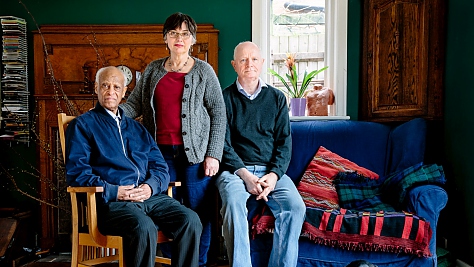 United Kingdom. Hilary and Jim Parle host 72-year-old Eritrean Yonasskindis*, who was on the verge of homelessness after his original asylum request was rejected by UK authorities, in Birmingham. This portrait is part of Great British Welcome, the UK chapter of the ongoing No Stranger Place series,