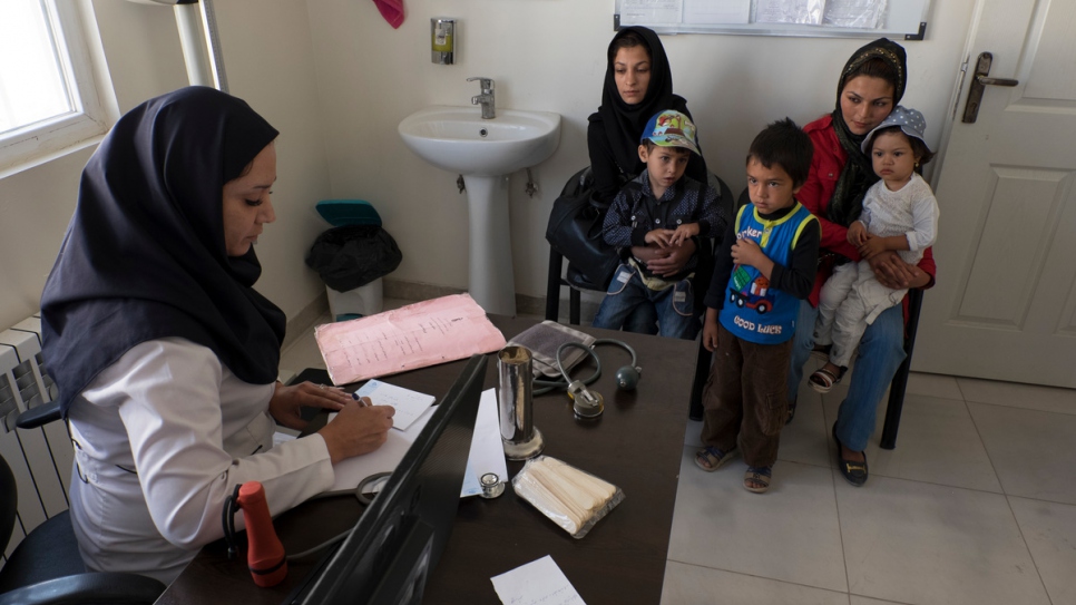 An Iranian doctor visits Afghan refugees at a health centre in Savejbolagh in Alborz province northwest of Tehran.