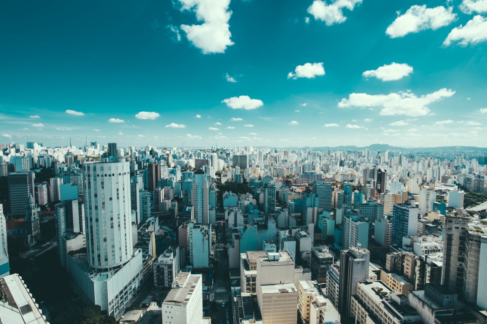 Wide shot of buildings in Sao Paulo, Brazil, with blue sky and clouds overhead