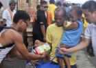 Distribution of relief items to Typhoon Haiyan survivors in Tacloban, Philippines