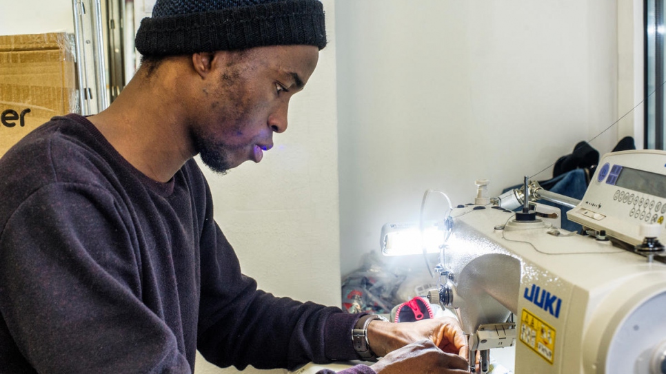 Cissé, a refugee from Côte d'Ivoire, works part-time at the Social Fabric workshop in Zürich.