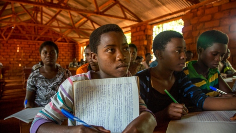 Tanzania. Refugee children battle the elements to learn