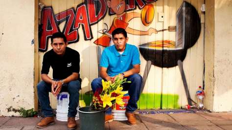 Mexico. Central American Refugees Jose Ismael and Leonel Antonio Diaz sell flowers in the streets of Tapachula, Mexico.