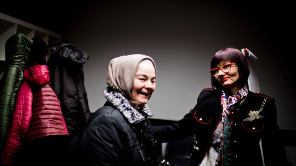 Zubidat Surkhayev, a refugee from Chechnya (left) and Bożena Perez-Borjas, her Polish teacher.