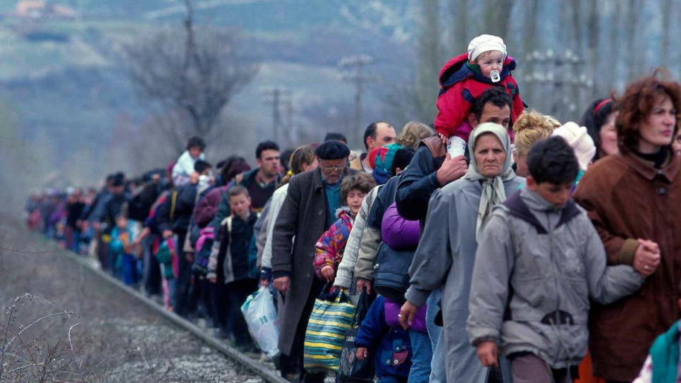 Refugees from Kosovo* arrive in Blace, in the former Yugoslav Republic of Macedonia, in March 1999.