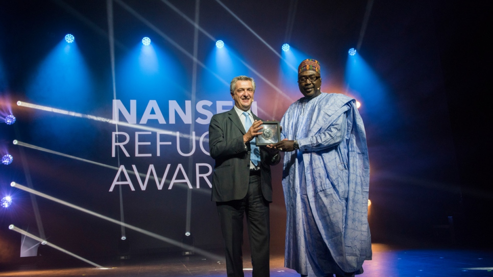 UN High Commissioner for Refugees Filippo Grandi presents the 2017 Nansen Refugee Award to Zannah Mustapha.