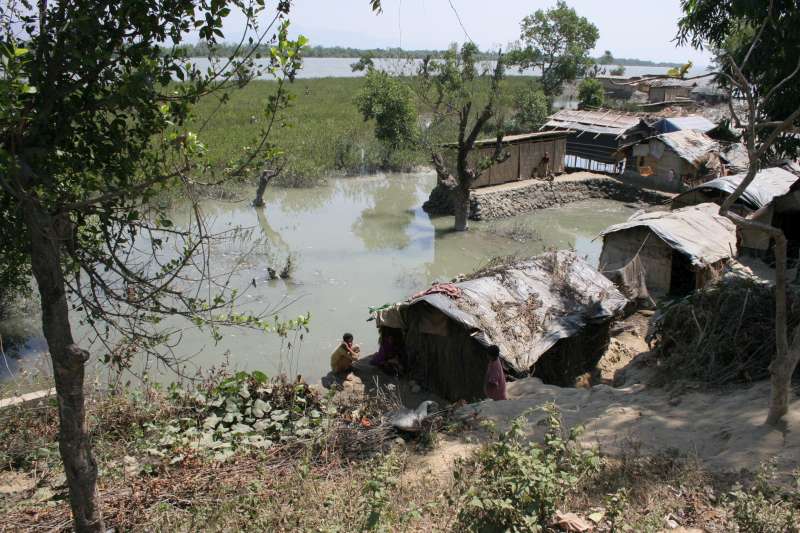 
With no place to go, some 6,000 unrecognized Muslim refugees from Myanmar built shelters by the Naf river, south of Cox’s Bazar, in Bangladesh. Conditions were harsh in an area prone to flooding and storms. 