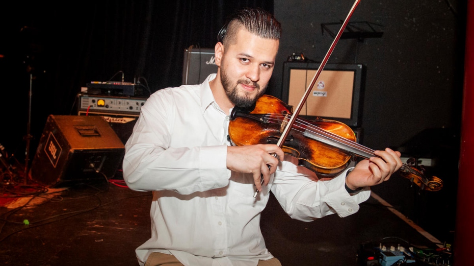 The project has allowed Said Ahmad Hoseini, 23, from Afghanistan to realize his dream of learning the violin.