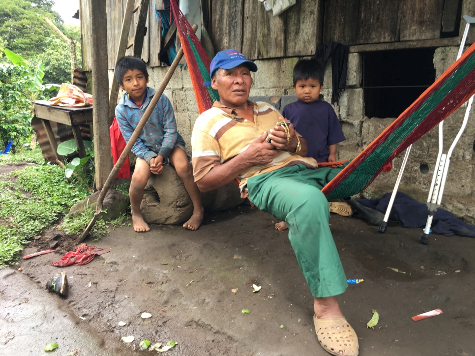 Head of the family Don Martin Andrade lies in a hammock at the farm where his family live and work in the highlands of southeast Costa Rica. He is flanked by Moises (left) and and Pablo (right).