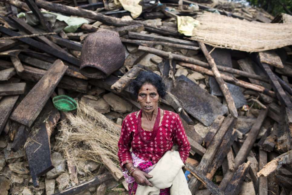 Nepal / Natural disaster/ Portrait of Kamala Sigala, 57 years, old at Selang in Shindupalchok.Her house is completely destroyed. Her father died due to the earthquake. Her husband is still at the hospital. She was working on the field. She is still afraid of the aftershocks.Many of the villages affected by the earthquake are in mountainous regions, served by few if any roads, and where aid has been slow to reach. / UNHCR / Diego Ibarra Sánchez / May 2015.