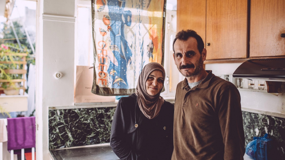 Ahmed Tarzalakis and his wife Jasmin in the kitchen of their apartment in Chania.