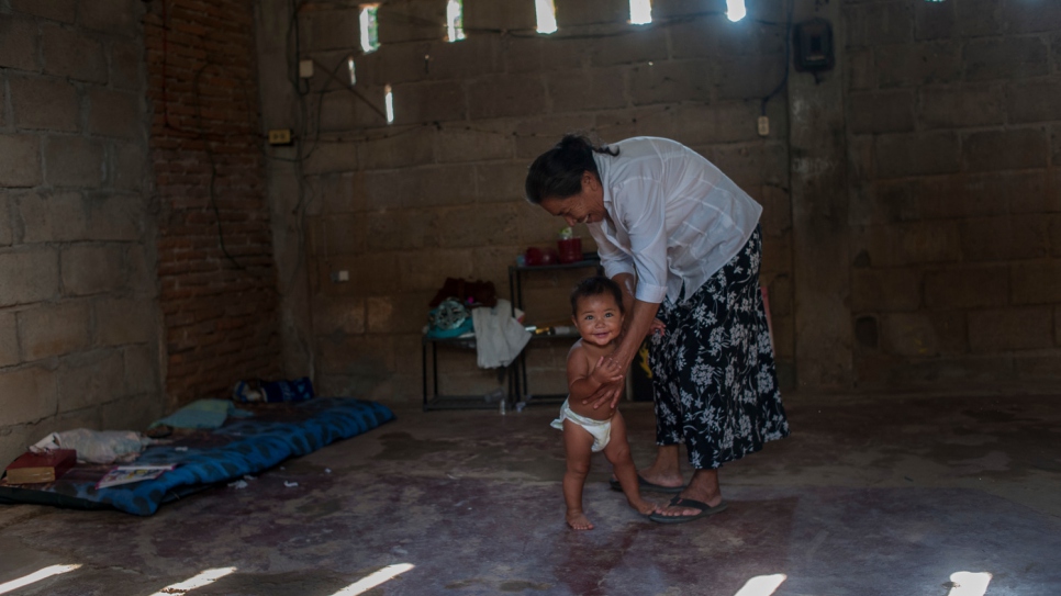 Margarita helps to care for the one-year-old daughter of her neighbours next door.