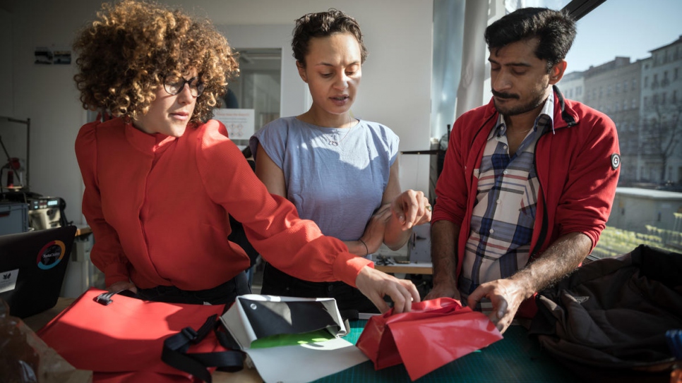 Abid (right) at the workshop with Mimycri co-founders Nora (center) and Vera (left).