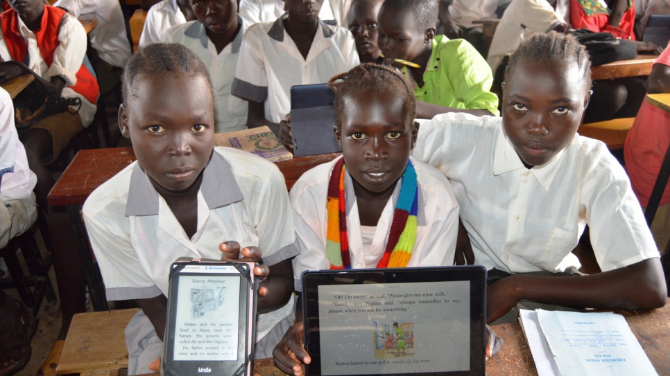 Students with the tablets they are learning to use.
