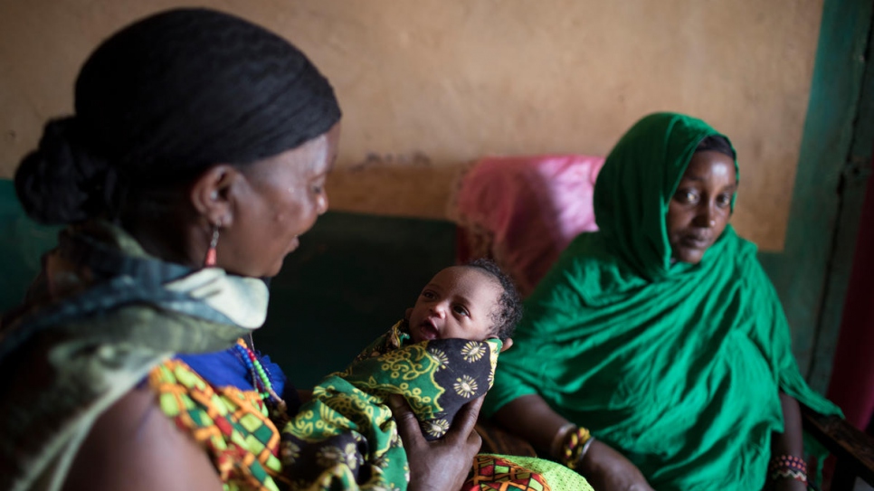 Sitting next to her daughter Malicha, Darmigalma cradles her grand daughter, Nuria. Only 48 hours after arriving in Moyale, Malicha went into labour with her 6th child. 