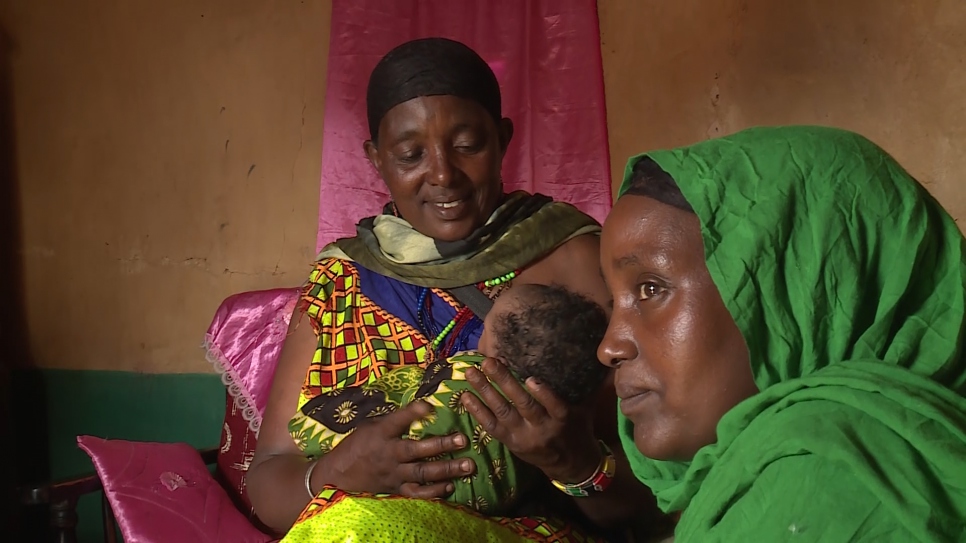 Darmigalma,55, holds her grandchild Nuria born just 48 hours after they crossed into Kenya from Ethiopia 
