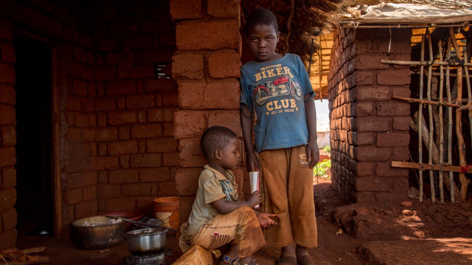 Partially-sighted Samwel (right) learns in classes of more than 100, without special materials.