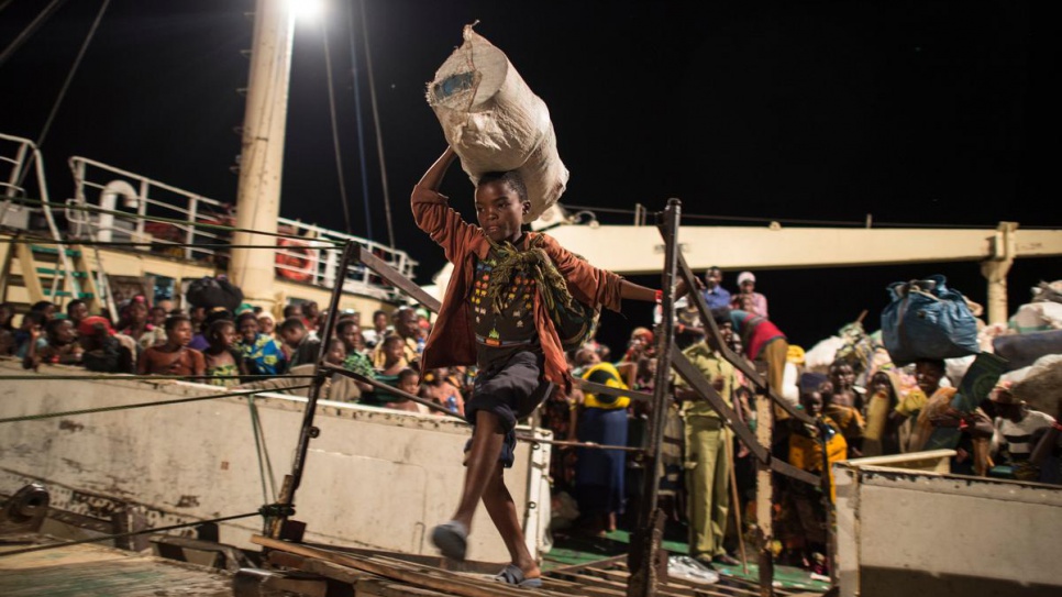 After waiting for days on the shore of Lake Tanganyika on Kagunga Peninsula, Burundian refugees disembark the MV Liemba in Kigoma. From here, they will be transferred to Nyaragusu refugee camp.