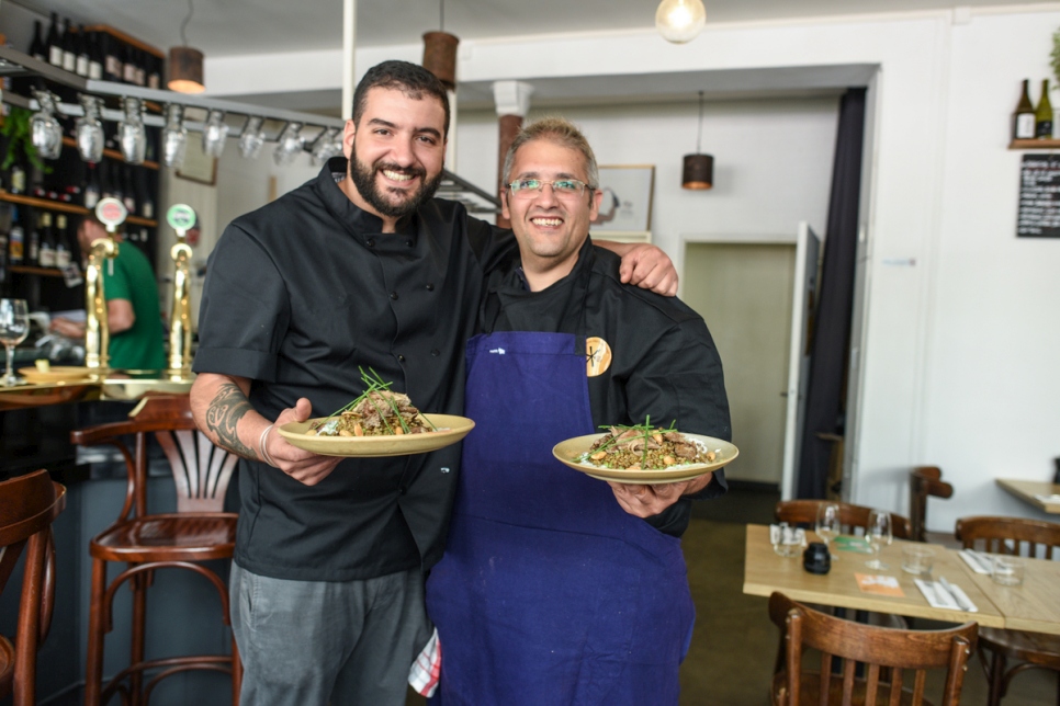 Syrian refugee chef Nabil Attar and French chef Walid Sahed show their joint creation at Les Pantins restaurant in Paris on June 16, 2017.

 
