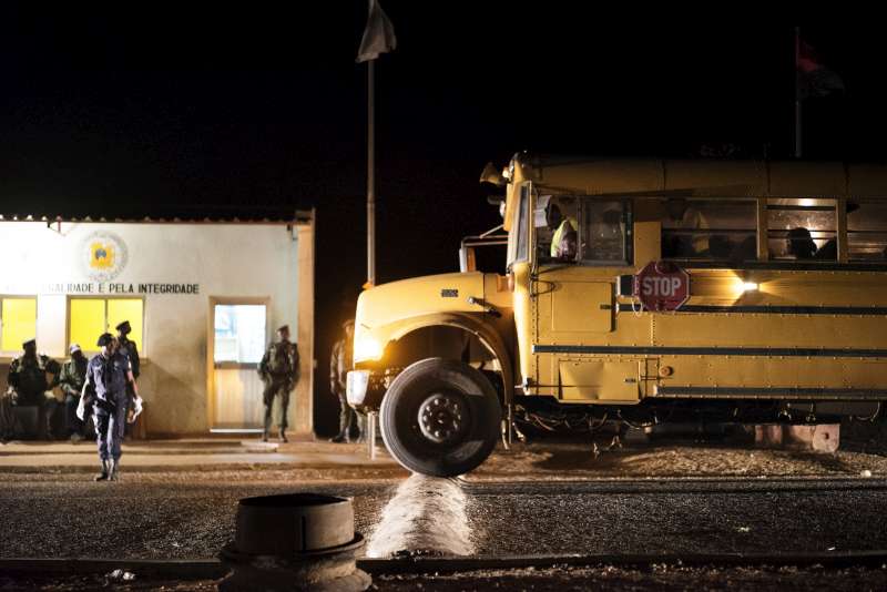 A bus crosses the border into Angola after those on board were cleared to coss by the Angolan officials. 