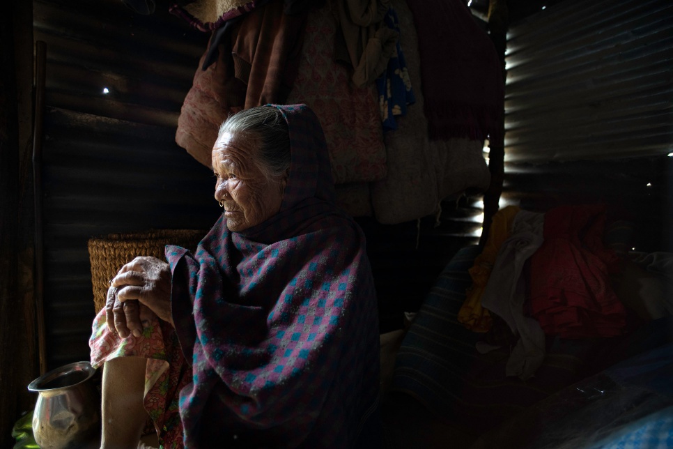 Antari Maya Jimba rests inside the shelter made of salvaged corrugated iron roofing that her family erected a day earlier in Jhankridanda village, in Nepal's Lalitpur District.